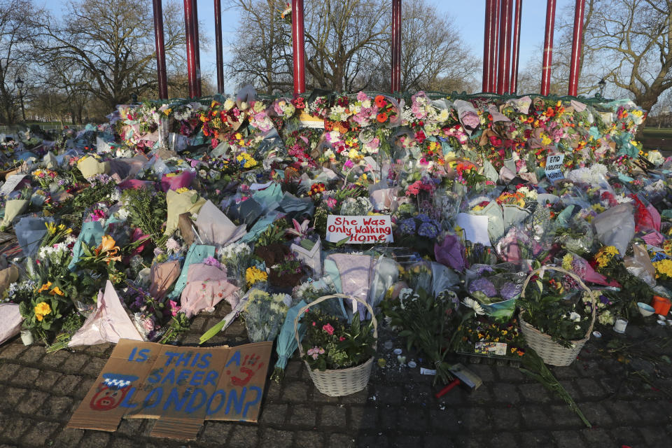 Floral tributes are placed at the bandstand in Clapham Common on Sunday, March 14, 2021, in memory of Sarah Everard who was abducted and murdered after last being seen walking home from a friend's apartment in south London on the night of March 3. Hundreds of people in London defied coronavirus restrictions Saturday to pay their respects to Everard who disappeared while walking home and was found dead a week later. (AP Photo/Tony Hicks)