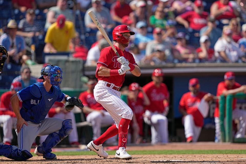 Philadelphia Phillies' Kody Clemens hits a single against the Toronto Blue Jays during the fourth inning of a spring training baseball game Tuesday, Feb. 28, 2023, in Clearwater, Fla. (AP Photo/David J. Phillip)