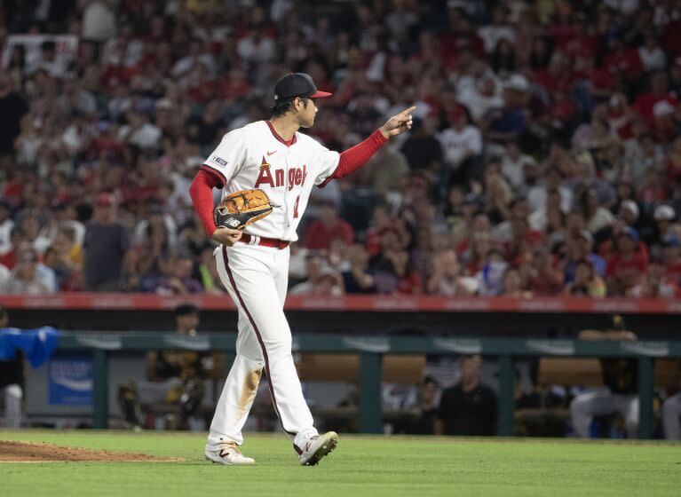 Anaheim, CA - July 21: Angels star starting pitcher, two-way player and designated hitter Shohei Ohtani leaves the mound and points to the crowd after pitching during a game with the Pirates at Angel Stadium in Anaheim Friday, July 21, 2023. (Allen J. Schaben / Los Angeles Times)