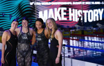 Team of the United States celebrates winning the women's 4x100m medley relay at the 19th FINA World Championships in Budapest, Hungary, Saturday, June 25, 2022. (AP Photo/Petr David Josek)