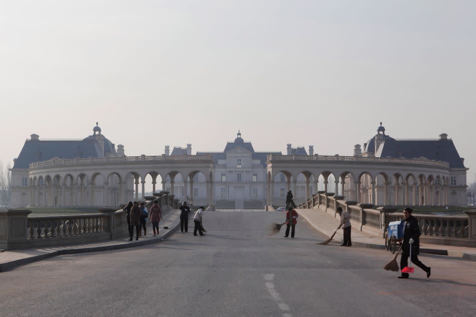 Maintenance staff at work in the premises of the Beijing Laffitte Chateau.