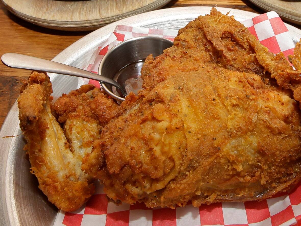 Foods like fried chicken are classified as ultra-processed foods, according to the Nova food classification system. By some estimates, Canadians consume nearly half of their caloric intake from the category. Experts agree they harm physical health, and they're also correlated with increased negative mental health, including depression and anxiety.   (Al Behrman/Associated Press - image credit)