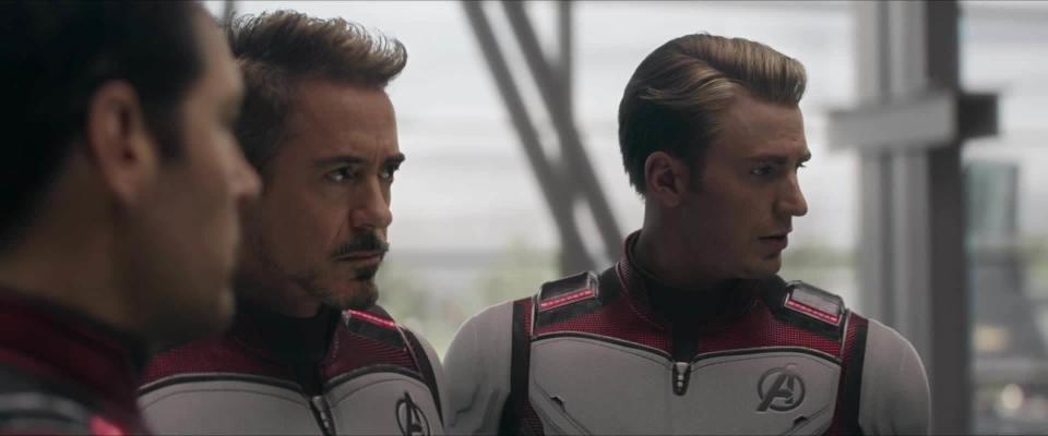 Close-up shot of Ant Man, Iron Man, and Captain America in red and white Avengers regalia.