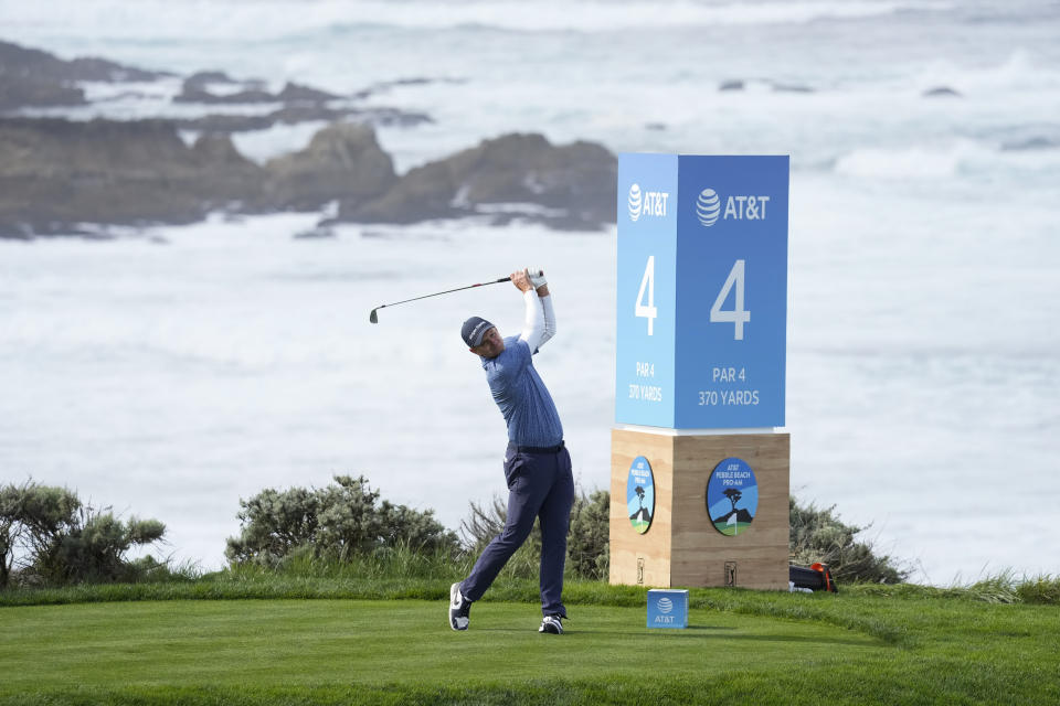 Justin Rose hits fro the fourth tee on the Spyglass Hill Golf Course during the first round of the AT&T Pebble Beach National Pro-Am golf tournament Thursday, Feb. 1, 2024, in Pebble Beach, Calif. (AP Photo/Eric Risberg)