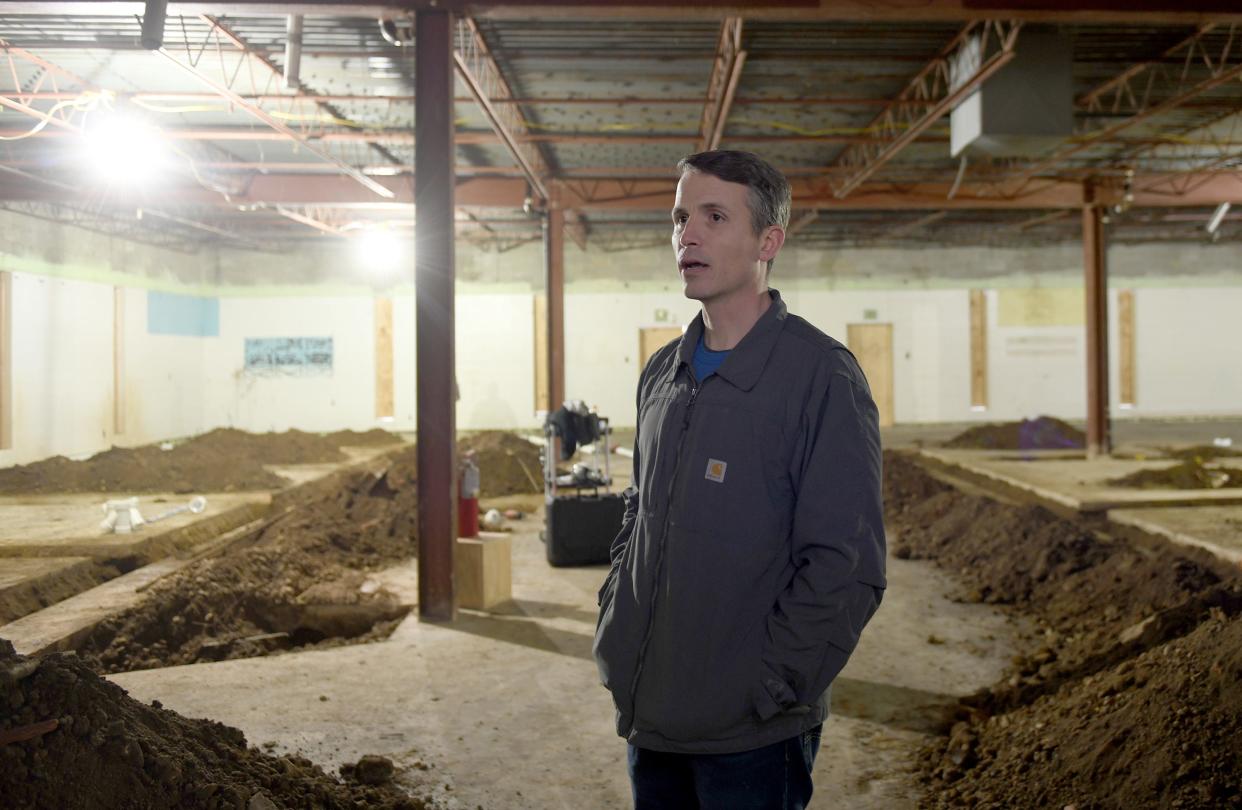 Don Ackerman, executive director of Canton For All People, discusses construction work at the future Southeast Community Market and Health Center at 1318 Gonder Ave. SE.