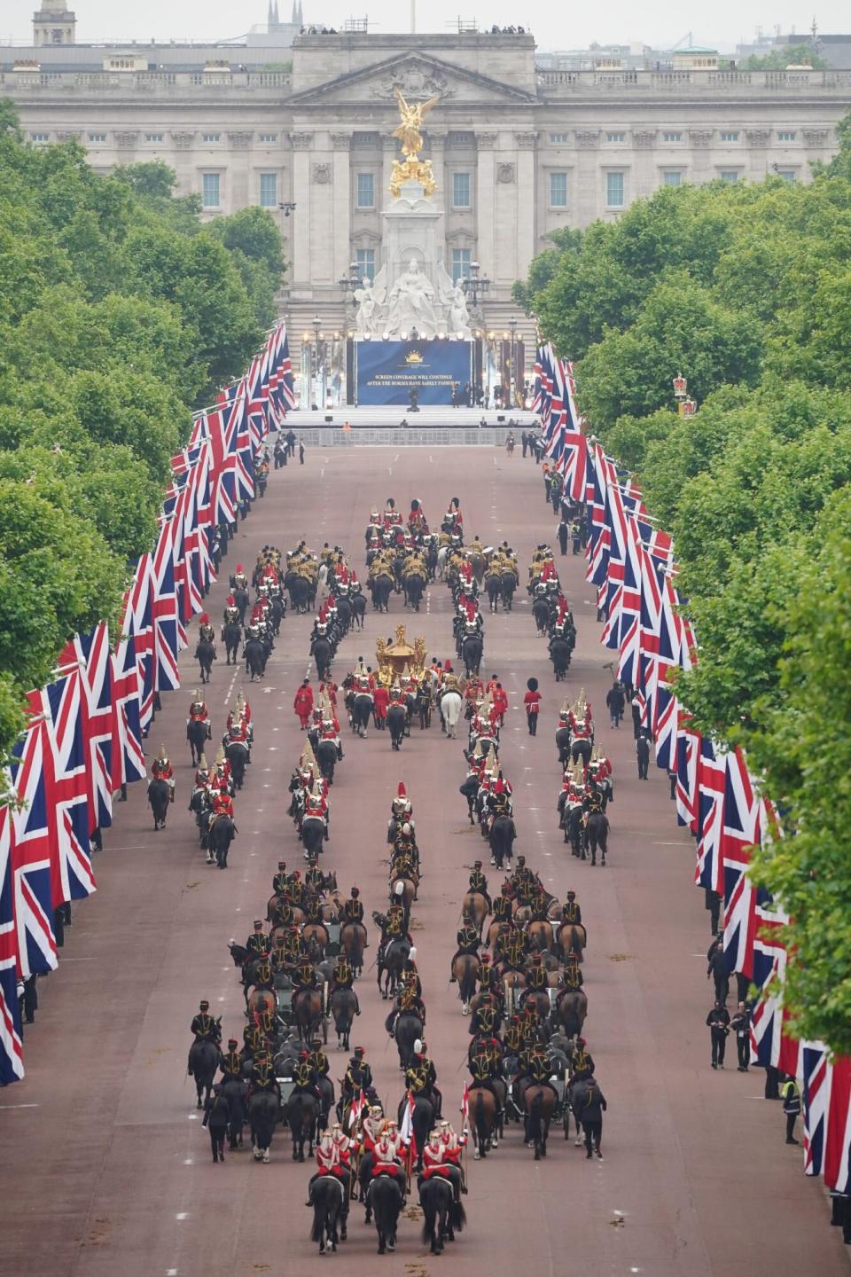 The Gold State Coach is seen on The Mall during the Platinum Jubilee Pageant in front of Buckingham Palace, London, on day four of the Platinum Jubilee celebrations. Picture date: Sunday June 5, 2022. (Photo by Dominic Lipinski/PA Images via Getty Images)