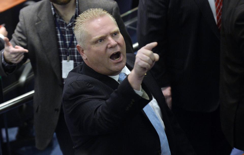 Toronto city councillor Doug Ford reacts to the public gallery during a special council meeting at City Hall in Toronto November 18, 2013. The Toronto city council may further curb the powers of embattled Mayor Rob Ford on Monday, slashing his office budget and offering his staff a chance to transfer to new jobs. REUTERS/Aaron Harris (CANADA - Tags: POLITICS)