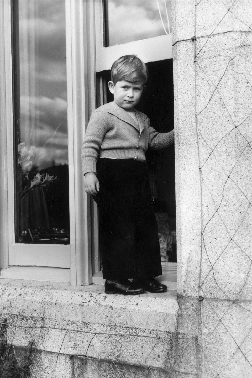 <p>Posing for a photo as a toddler at Balmoral Castle in Scotland. </p>