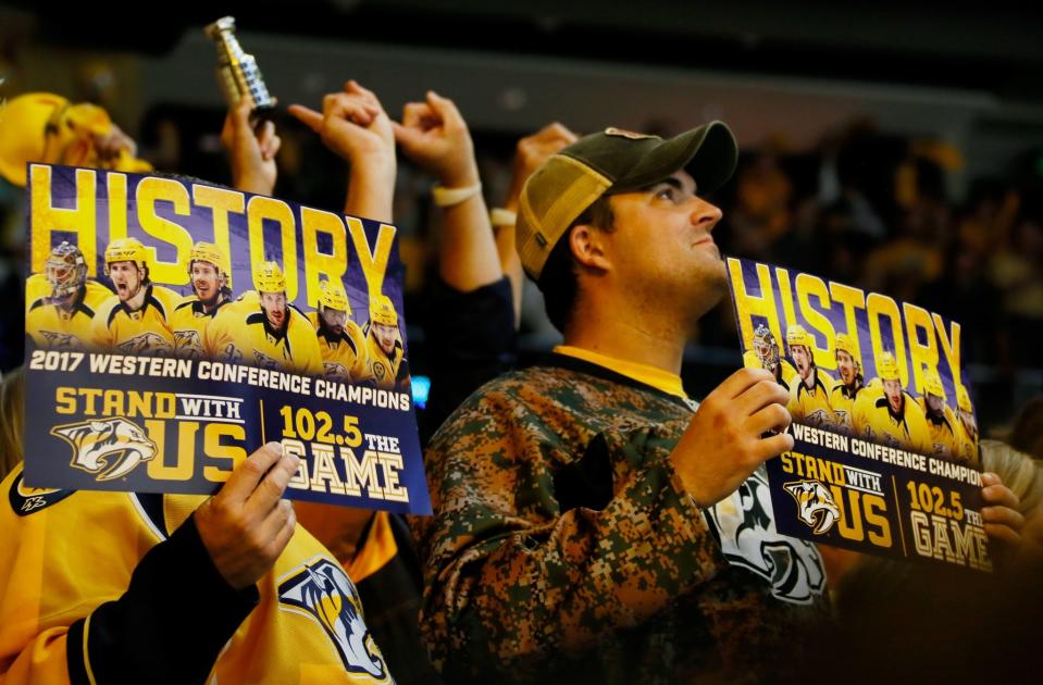 <p>Fans celebrate after the Nashville Predators defeated the Anaheim Ducks 6 to 3 in Game Six of the Western Conference Final during the 2017 Stanley Cup Playoffs at Bridgestone Arena on May 22, 2017 in Nashville, Tennessee. (Photo by Frederick Breedon/Getty Images) </p>