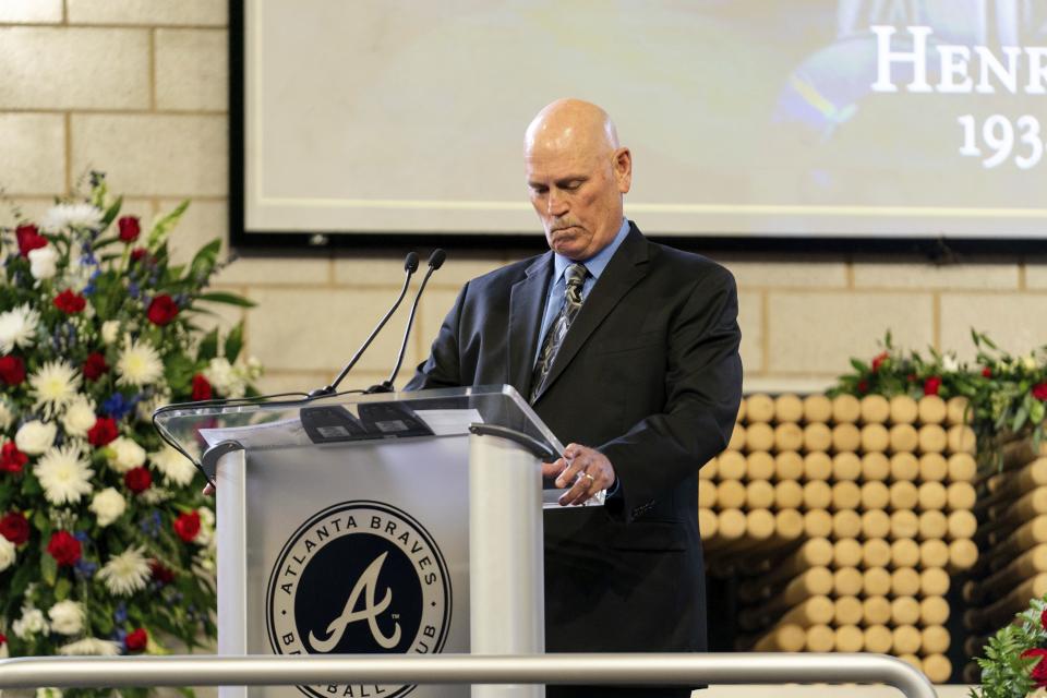 Atlanta Braves Manager Brian Snitker takes a moment to collect himself while speaking during "A Celebration of Henry Louis Aaron," a memorial service celebrating the life and enduring legacy of the late Hall of Famer and American icon, on Tuesday, Jan. 26, 2021, at Truist Park in Atlanta. (Kevin D. Liles/Atlanta Braves via AP Pool)