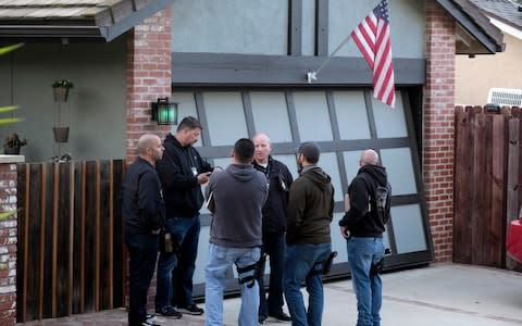 Ventura County Sheriff's deputies stand outside the house of shooting suspect David Ian Long in Newbury Park - Credit: AP