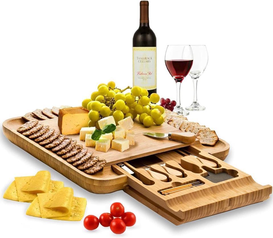<p><strong>Bambüsi</strong></p><p>amazon.com</p><p><strong>$59.99</strong></p><p>This elegant bamboo charcuterie board is perfect for a romantic date night at home. It features a hidden drawer with cheese knives, a wine opener, and more accessories.</p>