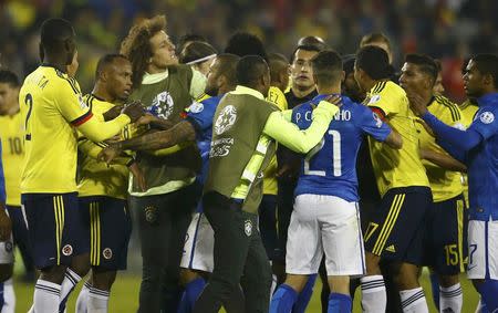 Brazil (in blue) and Colombia players scuffle at the end of their first round Copa America 2015 soccer match at Estadio Monumental David Arellano in Santiago, Chile, June 17, 2015. REUTERS/Ricardo Moraes