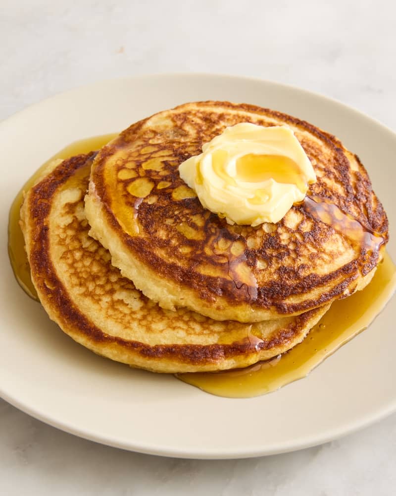 pancakes on a plate with butter and syrup