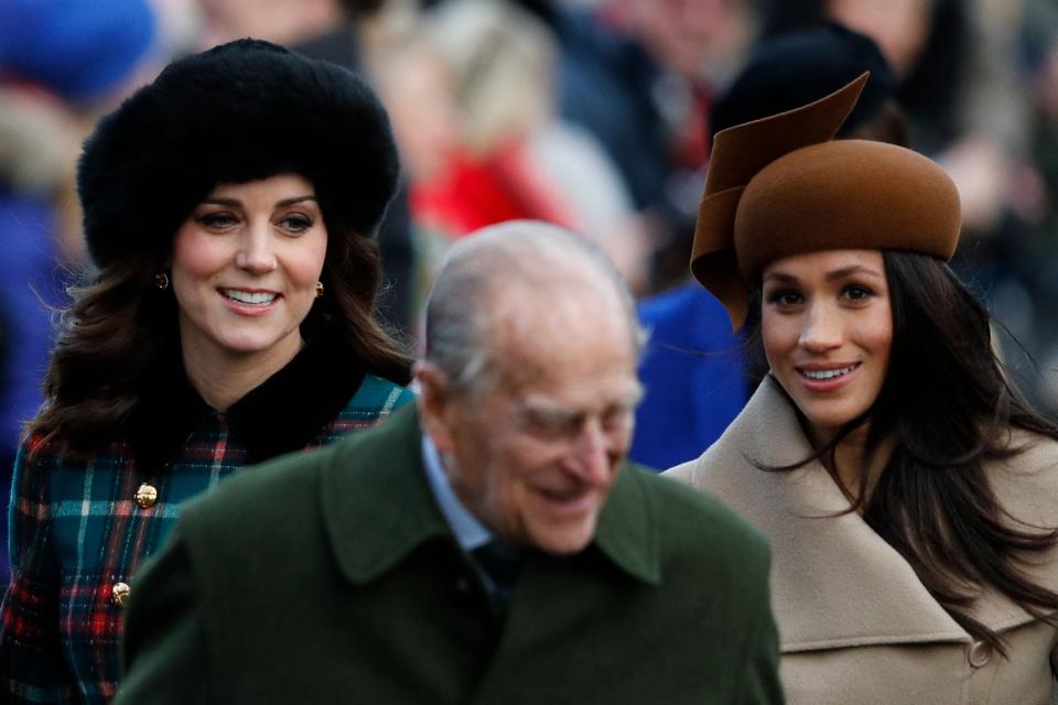 Catherine, Duchess of Cambridge, Britain's Prince Philip, Duke of Edinburgh and US actress and fiancee of Britain's Prince Harry Meghan Markle (R) arrive to attend the Royal Family's traditional Christmas Day church service at St Mary Magdalene Church in Sandringham, Norfolk, eastern England, on December 25, 2017.