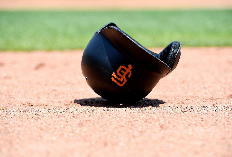 SAN FRANCISCO, CA - AUGUST 20:  A detailed view of the batting helmet belonging to Joe Panik #12 of the San Francisco Giants lays on the field during a game against the New York Mets at AT&T Park on August 20, 2016 in San Francisco, California.  (Photo by Thearon W. Henderson/Getty Images)