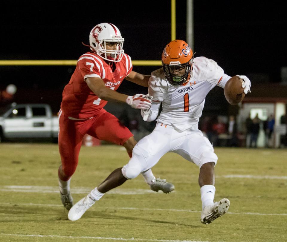 Jacob Copeland (1) carries the football during the Escambia vs Crestview high school playoff football game at Crestview High School on Friday, November 17, 2017.