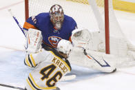 New York Islanders goalie Semyon Varlamov (40), of Russia, saves a shot from Boston Bruins' David Krejci (46), of the Czech Republic, during the second period of an NHL hockey game Monday, Jan. 18, 2021, in Uniondale, N.Y. (AP Photo/Jason DeCrow)