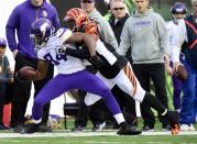 Dec 22, 2013; Cincinnati, OH, USA; Minnesota Vikings wide receiver Cordarrelle Patterson (84) is tackled by Cincinnati Bengals outside linebacker Vontaze Burfict (55) during the second half of the game at Paul Brown Stadium. Cincinnati Bengals beat Minnesota Vikings 42-14. Mandatory Credit: Marc Lebryk-USA TODAY Sports