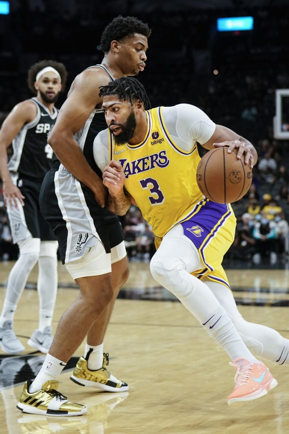 Lakers' Anthony Davis drives against San Antonio Spurs' Keldon Johnson.