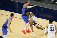 Dallas Mavericks guard Luka Doncic (77) defends against Minnesota Timberwolves forward Jaden McDaniels (3) in the first quarter during an NBA basketball game, Sunday, May 16, 2021, in Minneapolis. (AP Photo/Andy Clayton-King)