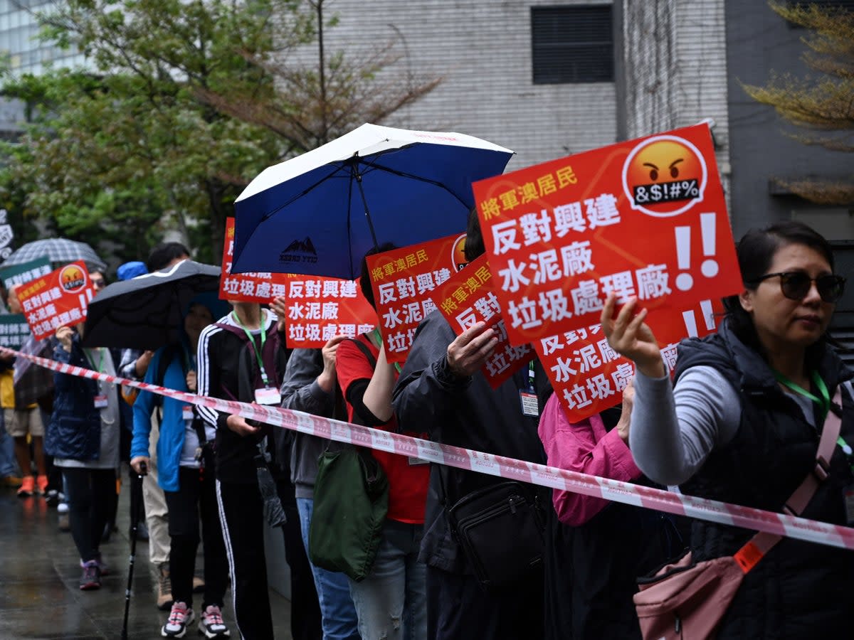 A group of residents hold the first authorised protest and march in several years in Hong Kong against the proposal for reclamation in the district on Tseung Kwan O on 26 March 2023 (AFP via Getty Images)