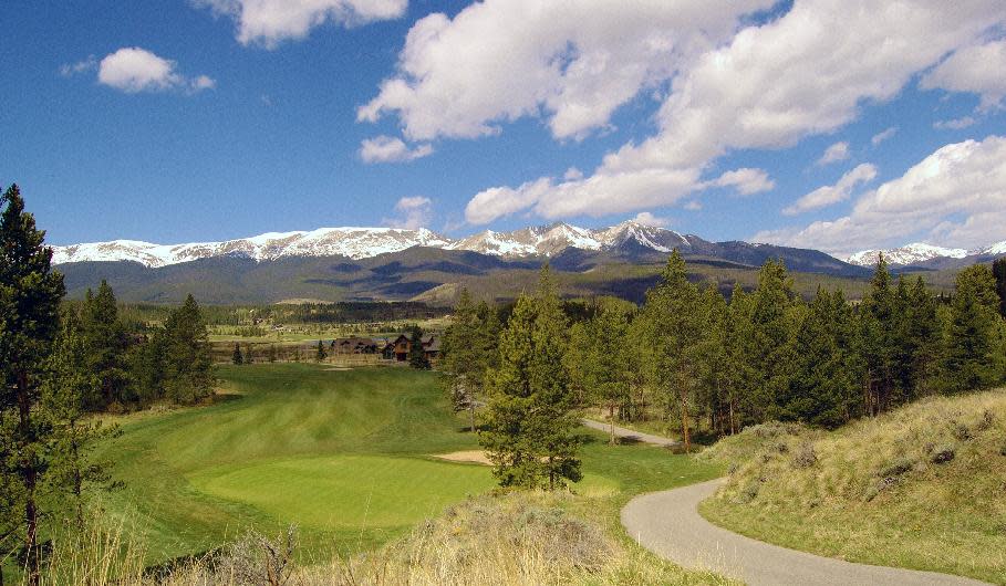 This 2012 photo provided by GoBreck shows a scenic view of the Breckenridge Golf Club in Breckenridge, Colo. Breckenridge may be best known as a ski resort but it offers many summer and fall activities for visitors, along with offseason deals. (AP Photo/GoBreck, Ian Leirfallom)