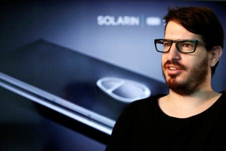 Moshe Hogeg, co-founder and president of British-Israeli start-up, Sirin Labs AG, manufacturers of Solarin, a mobile device with unprecedented levels of technology and security, speaks during an interview with Reuters at their offices in Tel Aviv, Israel May 16, 2016. REUTERS/Amir Cohen      TPX IMAGES OF THE DAY - S1BETHKDEGAB