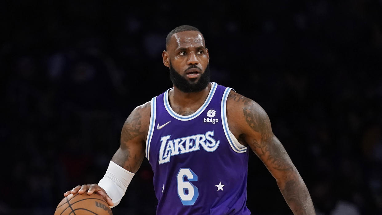 Los Angeles Lakers forward LeBron James (6) controls the ball during an NBA basketball game against the Los Angeles Clippers in Los Angeles, Friday, Dec. 3, 2021. (AP Photo/Ashley Landis)