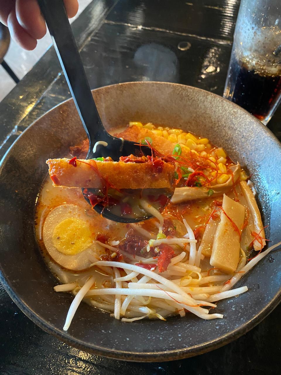 A chicken katsu ramen, consisting of fried chicken, bean sprouts, corn, scallions, bamboo shoots, sesame seeds, noodles, a hard-boiled egg and fresh homemade broth is cooked at Malis Sushi and Ramen restaurant in Raynham on Thursday, Feb. 8, 2024.