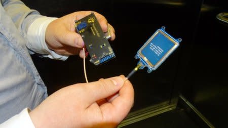 F-Secure researcher Timo Hirvonen shows a device that is able to create a master key out of a single hotel key card in Helsinki, Finland April 19, 2018. Picture taken April 19, 2018. REUTERS/Attila Cser