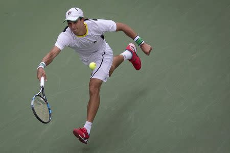 Evgeny Donskoy of Russia lunges for the ball from Marin Cilic of Croatia during their second round match at the U.S. Open Championships tennis tournament in New York, September 2, 2015. REUTERS/Carlo Allegri Picture Supplied by Action Images