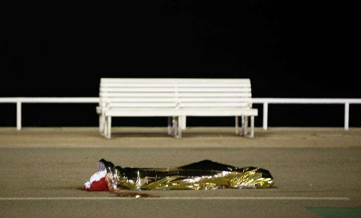 <p>A body is seen on the ground July 15, 2016 after at least 30 people were killed in Nice, France, when a truck ran into a crowd celebrating the Bastille Day national holiday July 14. (Eric Gaillard/Reuters) </p>