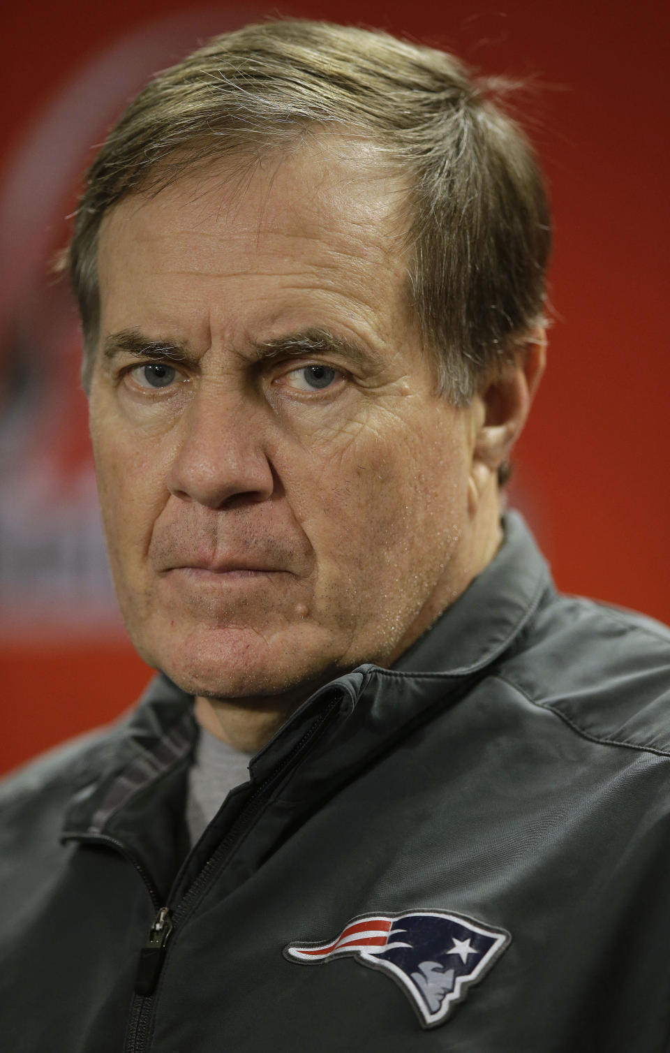 New England Patriots head coach Bill Belichick listens to a reporter's question during a media availability at the NFL football team's facility in Foxborough, Mass., Wednesday, Jan. 15, 2014. The Patriots will play the Denver Broncos in the AFC Championship game Sunday in Denver. (AP Photo/Stephan Savoia)