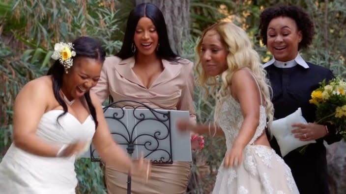 In a surprise wedding ceremony on Monday’s “Cardi Tries___” episode, (from left) bride Brandi Taylor, rap star/officiant Cardi B, bride Shannon Herbert and ring bearer Raven-Symoné share a sweet moment. (Photo: Facebook)