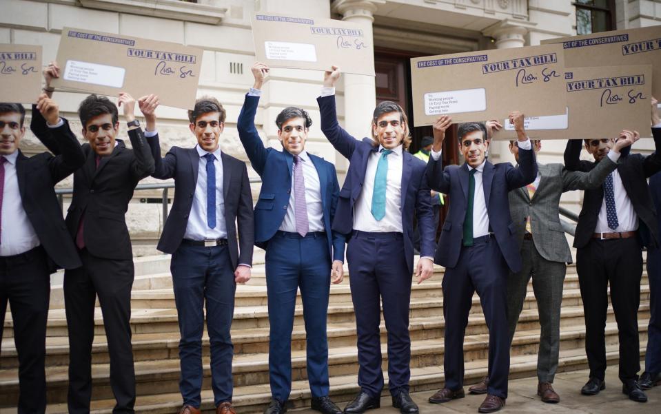 Campaigners dressed as Rishi Sunak protest outside the Treasury Office in London, as it emerges the Chancellor's popularity has fallen - Yui Mok 