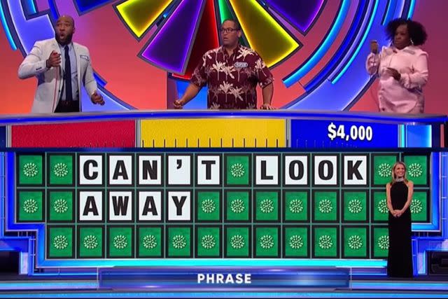 <p>CBS</p> 'Wheel of Fortune' contestants accidentally celebrate wrong answer