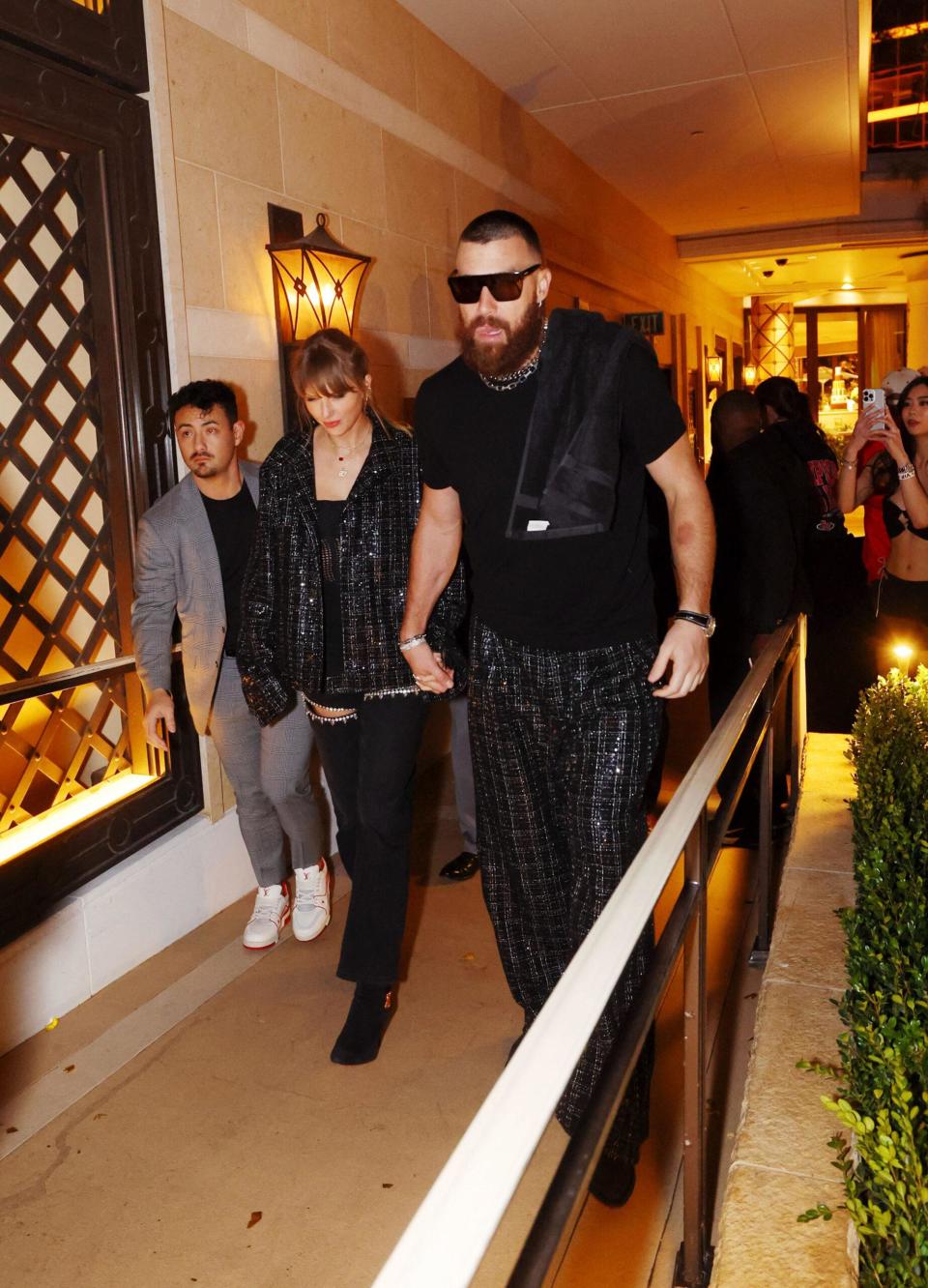 Travis Kelce and Taylor Swift holding hands