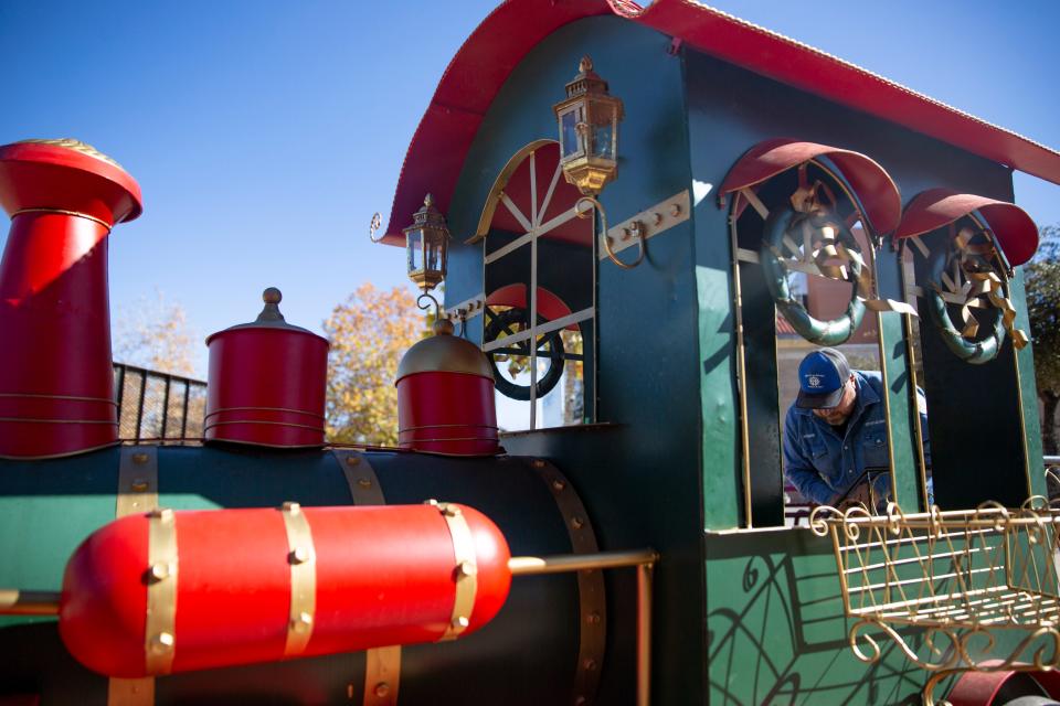 City employees set up holiday decorations on Tuesday, Nov. 29, 2022, at the plaza in downtown Las Cruces. 