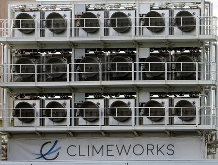 A facility for capturing CO2 from air of Swiss Climeworks AG is placed on the roof of a waste incinerating plant in Hinwil, Switzerland July 18, 2017. Picture taken July 18, 2017. REUTERS/Arnd Wiegmann