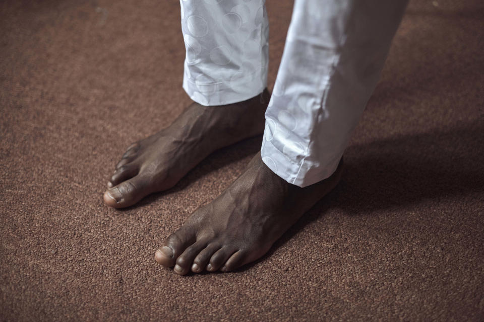 Abdoul, 32 year-old migrant from Maghama, Mauritania poses for a photograph at his shared apartment on Friday, Oct. 6, 2023, in New York. Abdoul traveled from Mauritania to New York via Istanbul, Bogota, El Salvador, Nicaragua, Honduras, Guatemala, Mexico and crossed the U.S. southern border in Texas on July 4, 2023. Abdoul is one of more than 8,000 migrants who have been jailed on criminal trespassing charges at the Texas border since Gov. Greg Abbott began authorizing the arrests in 2021. (AP Photo/Andres Kudacki)