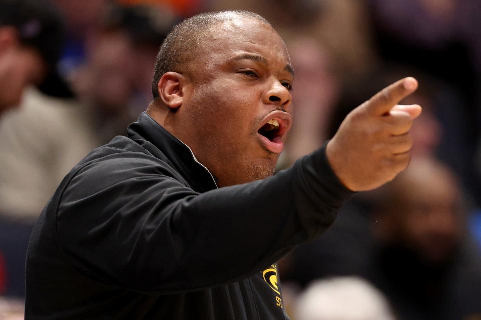 DAYTON, OHIO - MARCH 20: Head coach Donte' Jackson of the Grambling State Tigers points against the Montana State Bobcats during overtime in the First Four game of the NCAA Men's Basketball Tournament at University of Dayton Arena on March 20, 2024 in Dayton, Ohio. (Photo by Michael Hickey/Getty Images)