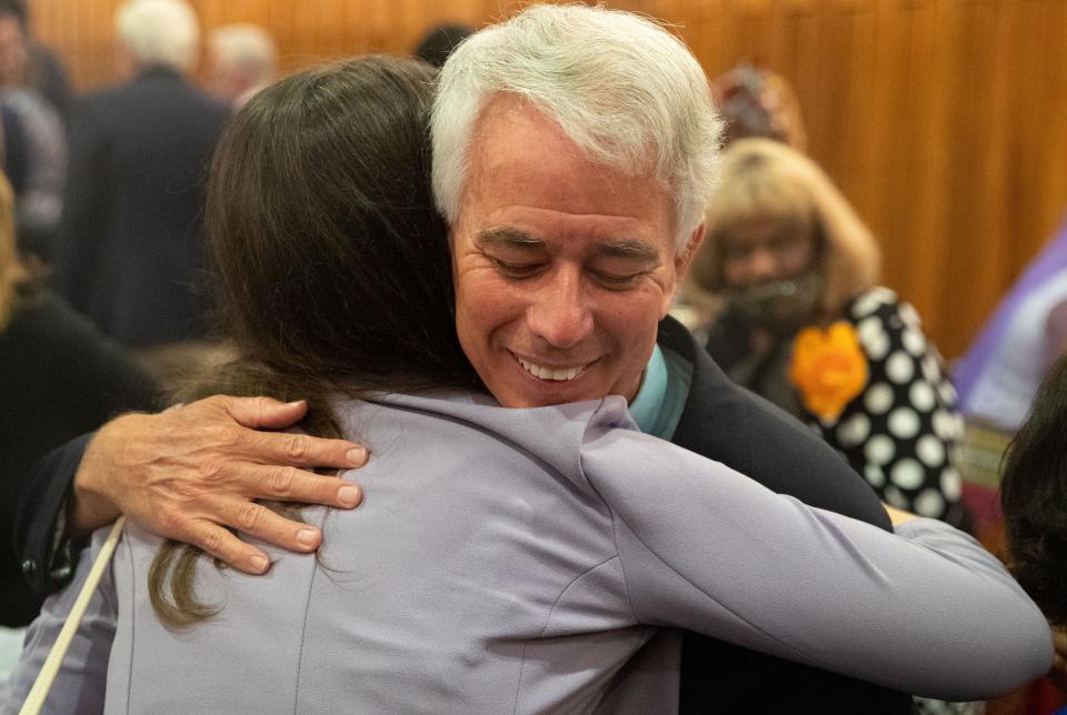 Steve Mulroy hugs his daughter, Molly Mulroy, after he is sworn in as the new Shelby County District Attorney General on Wednesday, Aug. 31, 2022, in the Shelby County Commission Chambers of the Vasco A. Smith Jr. County Administration Building. 