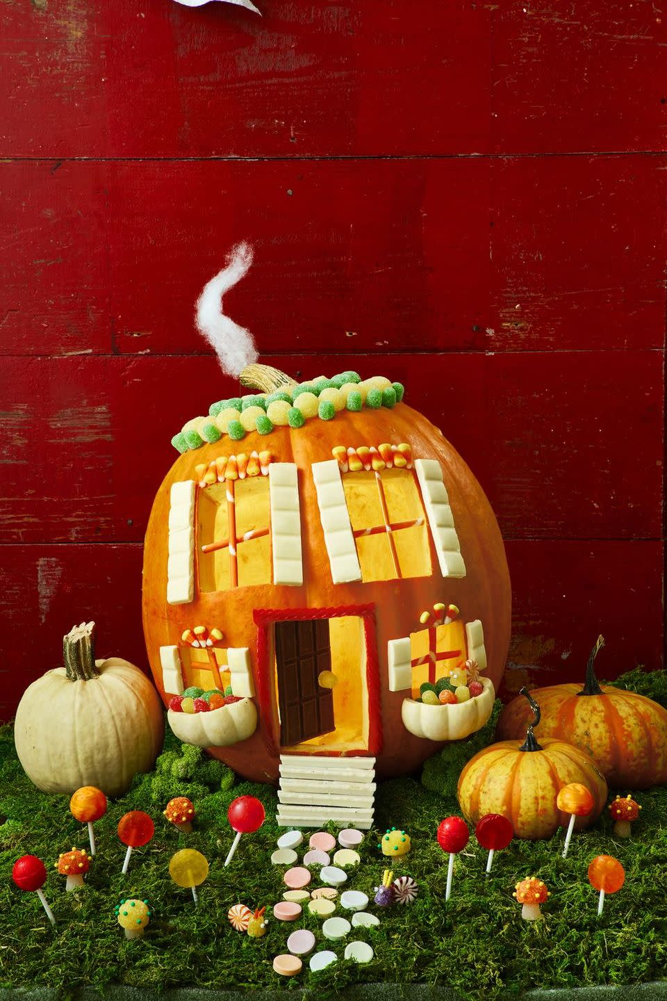 <p>Open up a few of your candy bags early and steal a couple of pieces to create this adorable house outfitted with gum drops, peppermints, candy corn, and more.</p><p><a href="https://www.womansday.com/home/crafts-projects/a29234431/candy-land/" rel="nofollow noopener" target="_blank" data-ylk="slk:Get the tutorial at Woman's Day »;elm:context_link;itc:0;sec:content-canvas" class="link "><em>Get the tutorial at Woman's Day »</em> </a></p>