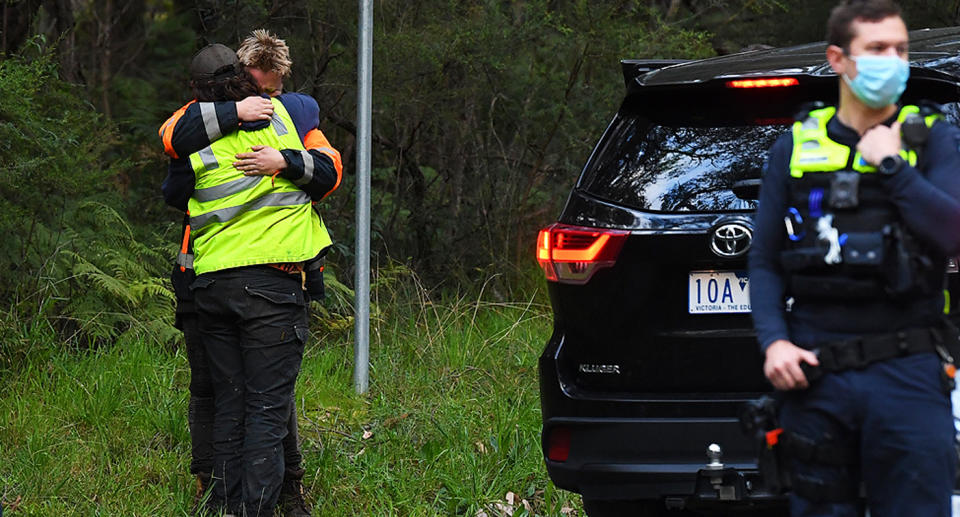 Members of the search party hug after news of William's death. Source: AAP