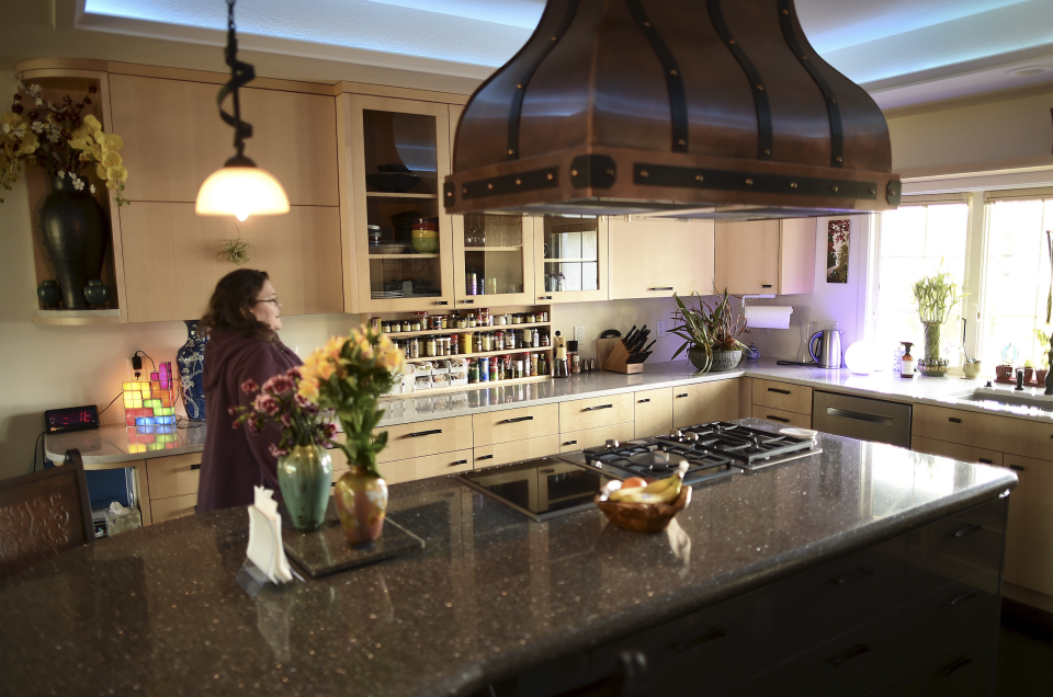 A woman walks through her kitchen in Santa Clara, California. This is not "Natalie." (Photo: REUTERS/Noah Berger)