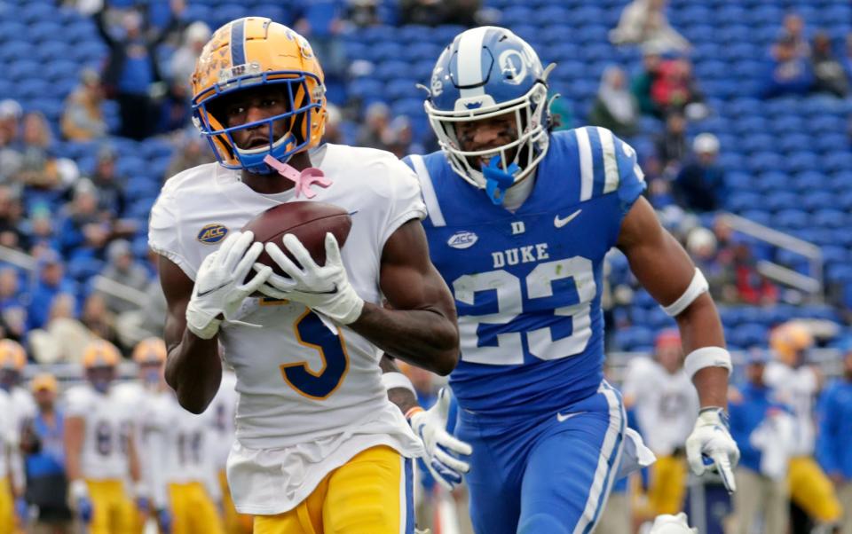 FILE - Pittsburgh wide receiver Jordan Addison (3) hauls in a pass for a touchdown against Duke safety Lummie Young IV (23) during the first half of an NCAA college football game Nov. 6, 2021, in Durham, N.C. Addison is exploring his options. The 2021 Biletnikoff Award winner as the nation's top receiver is in the NCAA transfer portal. Addison put in his paperwork by the May 1 deadline and his entry became visible Tuesday. (AP Photo/Chris Seward, File)