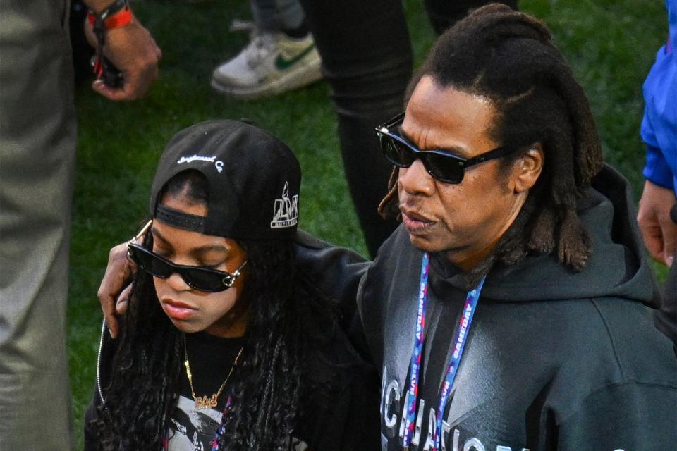 Rapper Jay-Z walks the sideline with his daughter Blue Ivy Carter before the Philadelphia Eagles play the Kansas City Chiefs in Super Bowl LVII at State Farm Stadium in Glendale, Arizona, on Sunday, February 12, 2023.