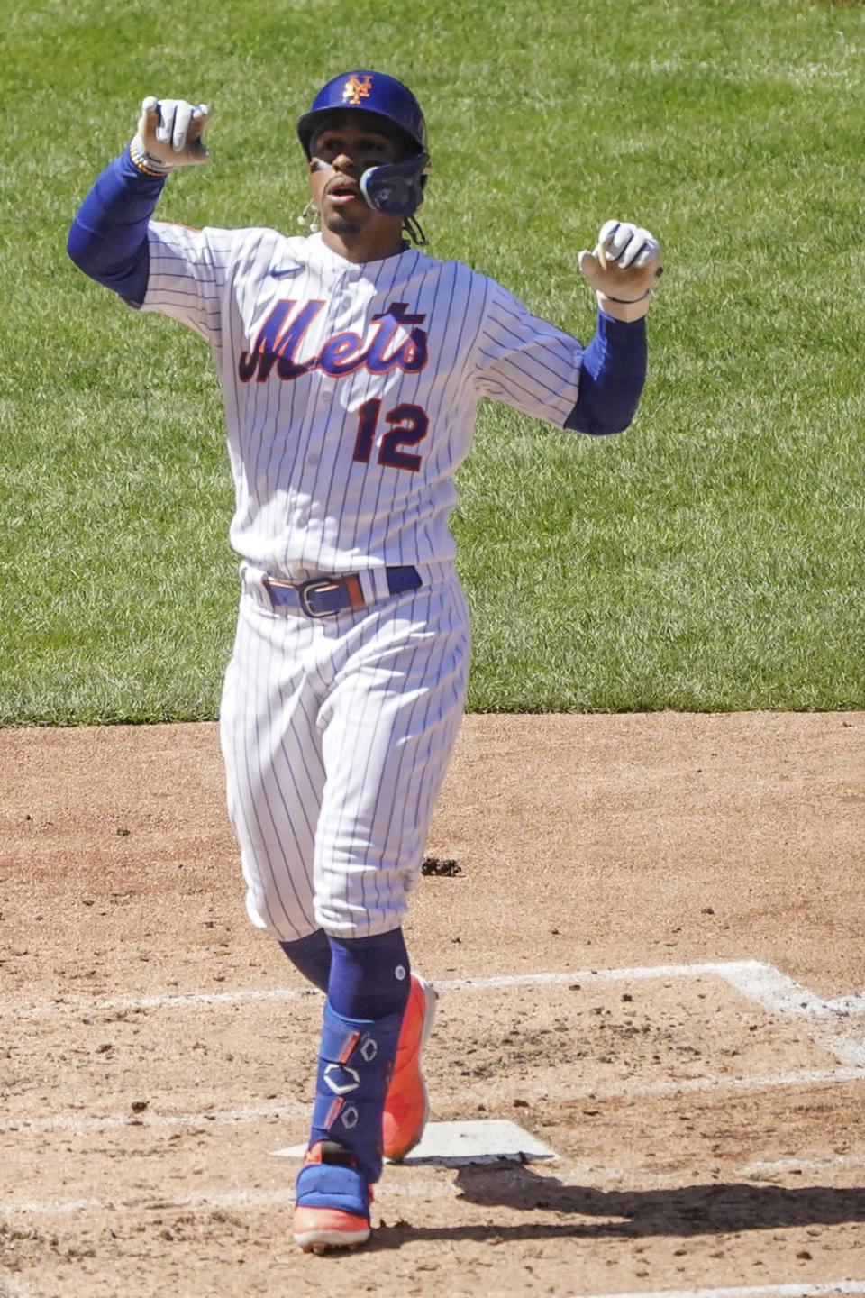 New York Mets' Francisco Lindor trots across home plate after his third inning home run during a baseball game against San Diego Padres, Wednesday, April 12, 2023, in New York. (AP Photo/Bebeto Matthews)