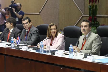 Director of the Cuban Foreign Ministry's North American affairs office Josefina Vidal (2nd R) takes part in negotiations to restore diplomatic ties with the U.S. in Havana January 21, 2015. REUTERS/Alexandre Meneghini